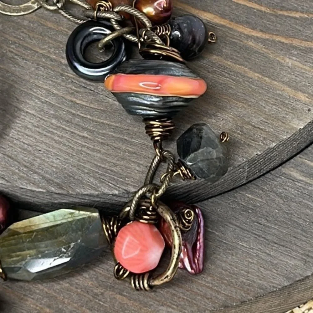 Artistic bracelet with wire wrapped stones.